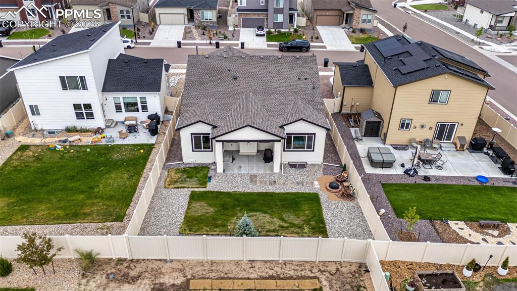 Image 38 of 41: Rear view of property with a residential view, a fenced backyard, and a pat