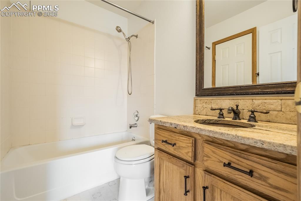 Image 15 of 34: Full bathroom featuring vanity and shower / bath combination