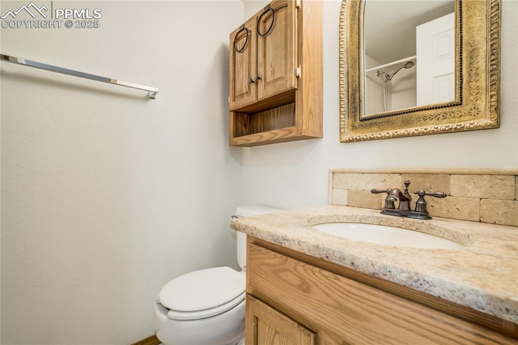 Image 24 of 34: Bathroom with vanity and toilet