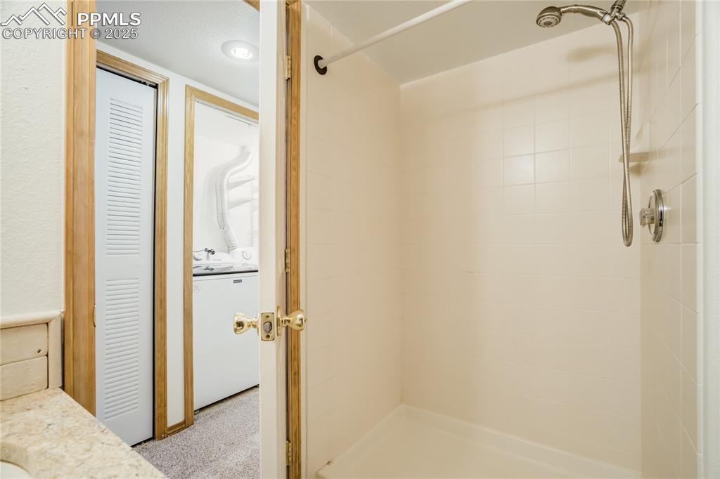 Image 25 of 34: Full bath featuring a shower and vanity