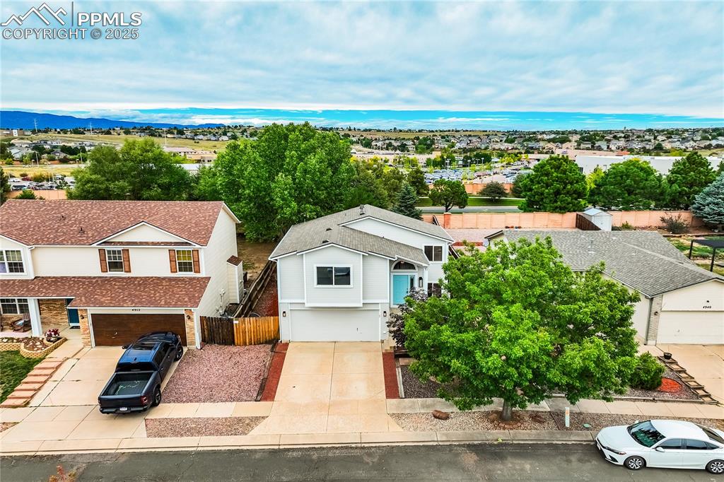Image 31 of 34: Aerial perspective of suburban area with a large body of water