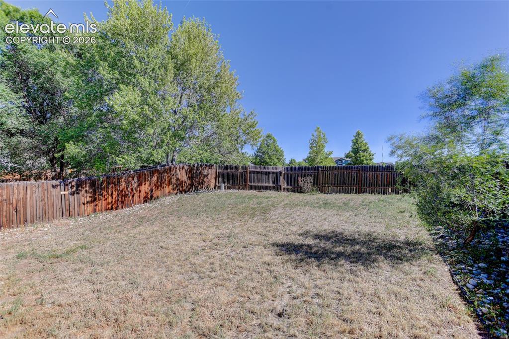 Image 18 of 20: Fully fenced backyard