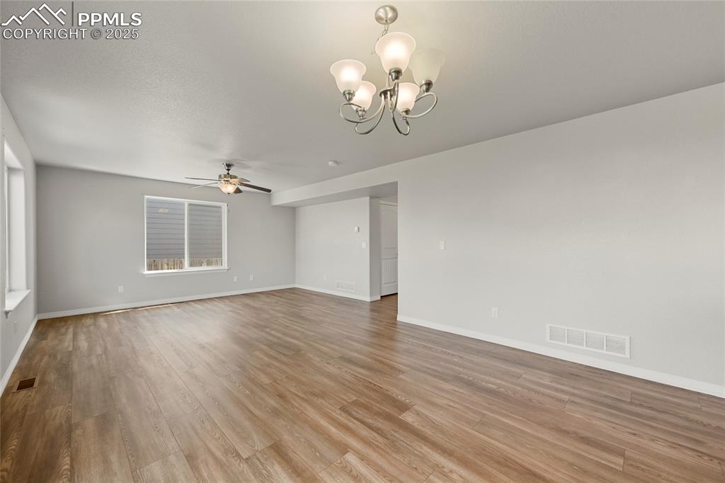 Image 10 of 29: Unfurnished room featuring a ceiling fan, light wood-type flooring, and a c