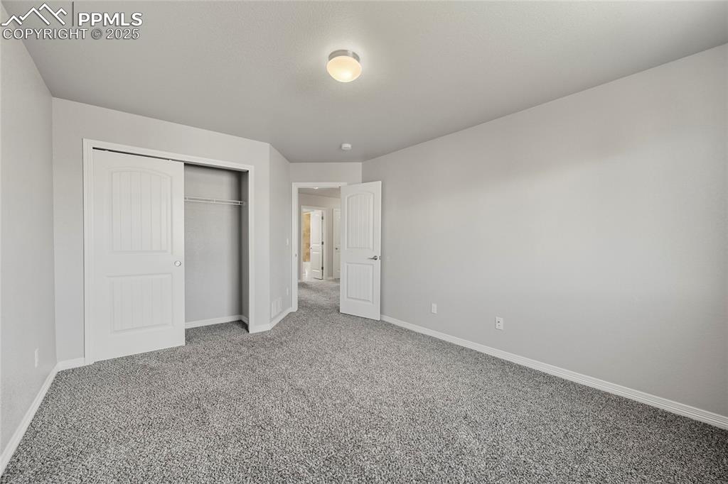 Image 21 of 29: Unfurnished bedroom featuring carpet floors and a closet