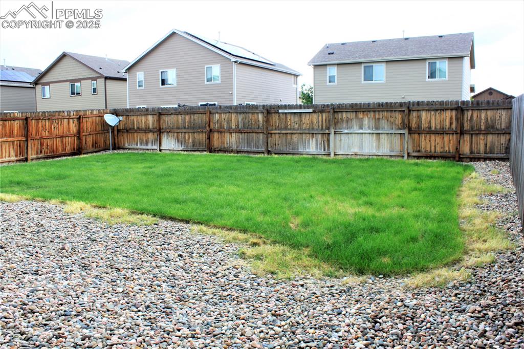 Image 28 of 29: View of fenced backyard