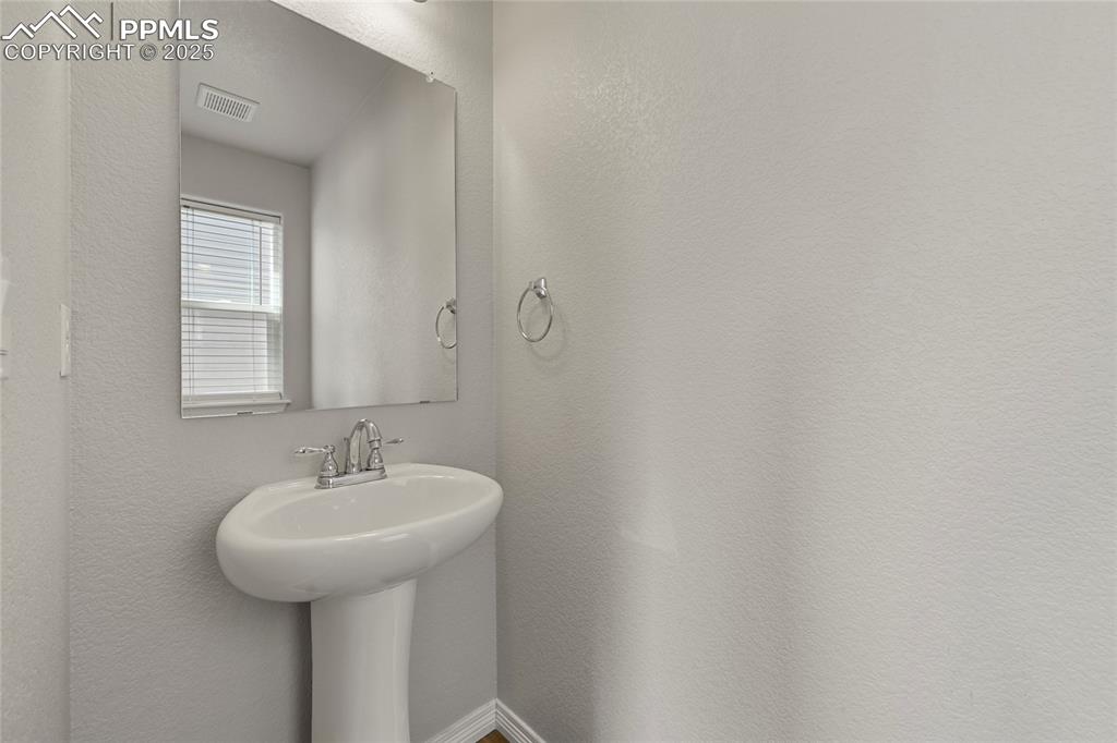 Image 5 of 29: Bathroom with a sink
