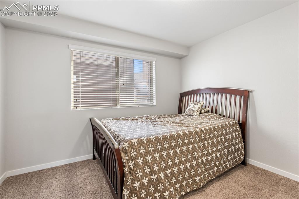 Image 22 of 50: Carpeted bedroom featuring baseboards