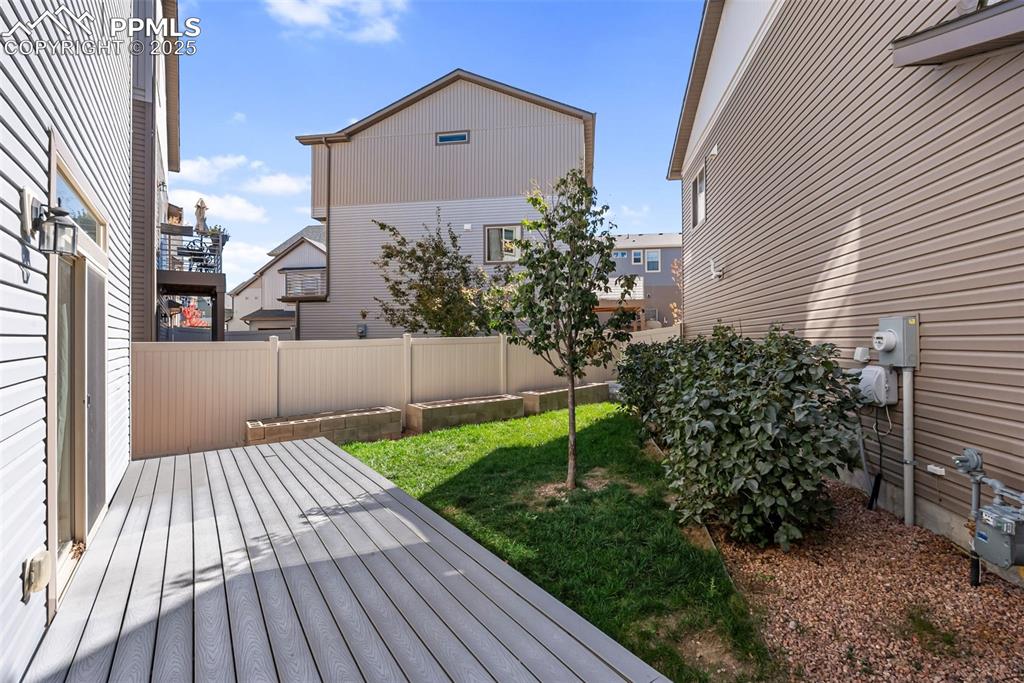 Image 38 of 50: Deck featuring a fenced backyard