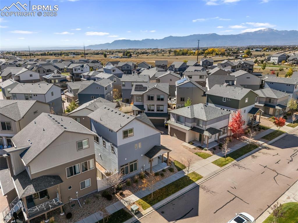 Image 46 of 50: Aerial perspective of suburban area featuring mountains