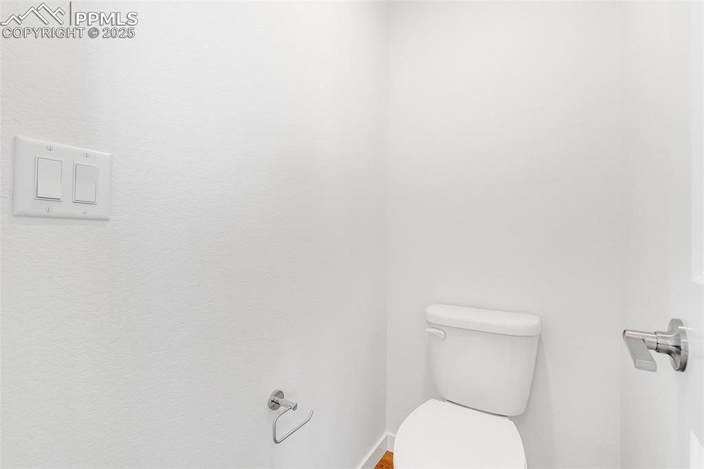 Image 27 of 39: Bathroom with toilet and baseboards