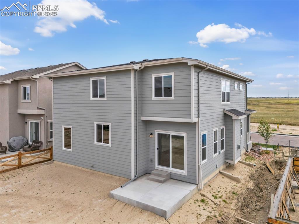 Image 37 of 39: Rear view of property with a patio and entry steps