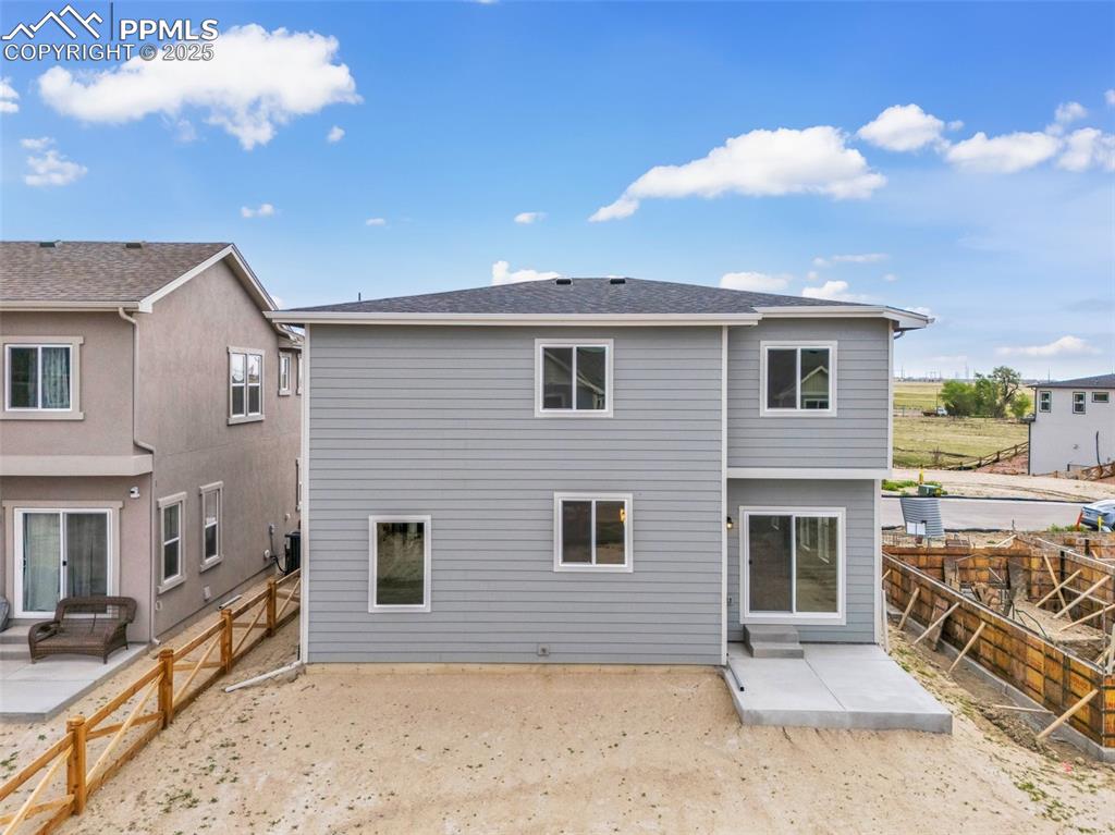 Image 38 of 39: Rear view of property with a patio area and a fenced backyard