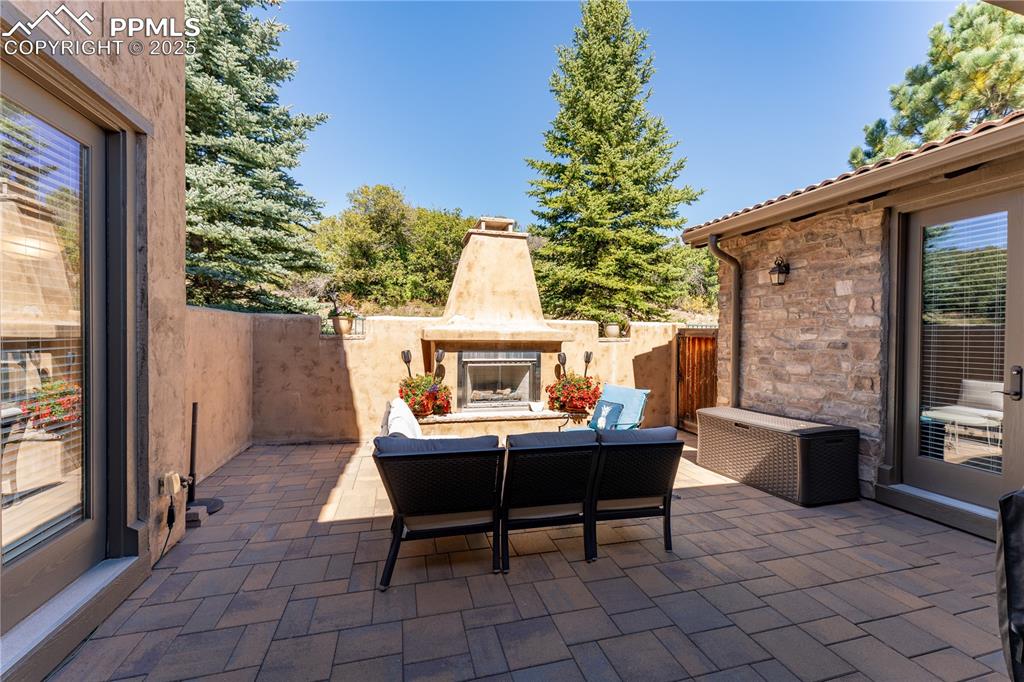 Image 14 of 36: Rear patio/courtyard connect to primary, entryway, and living room