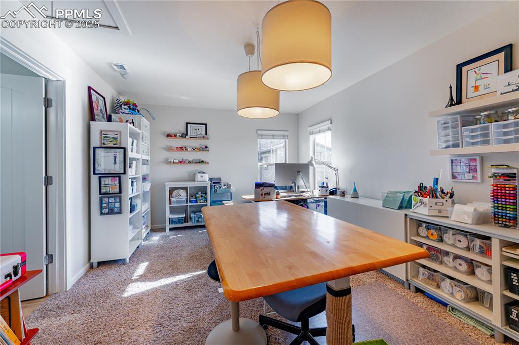 Image 26 of 36: Upstairs bedroom 2, used as a craft room