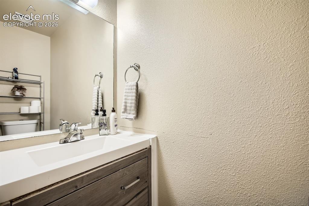 Image 11 of 31: Main level powder room