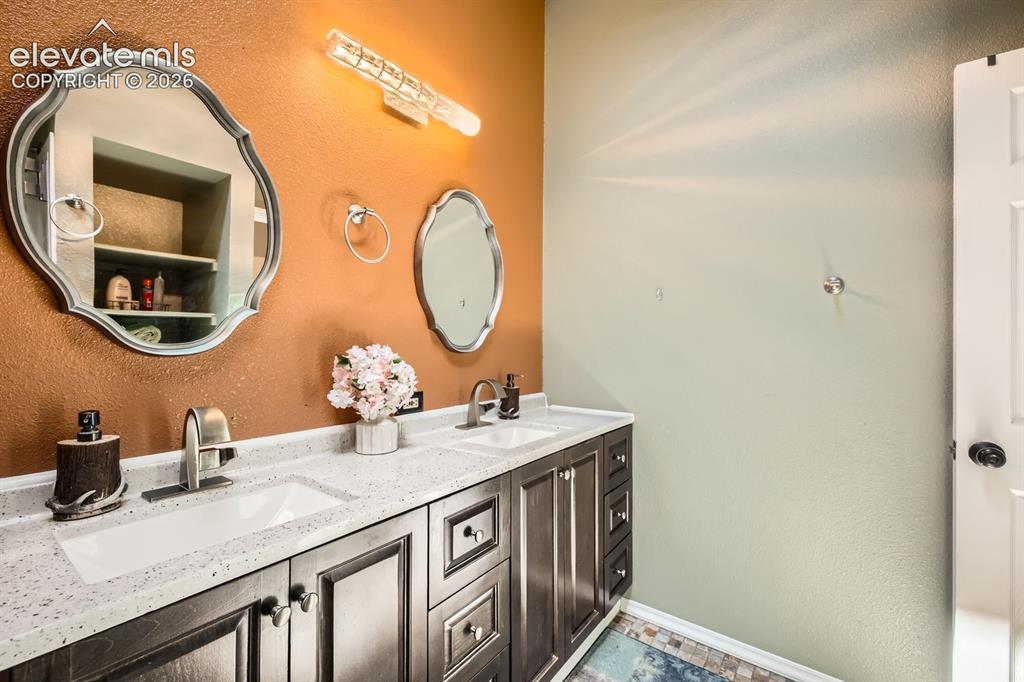 Image 16 of 31: Upstairs bathroom with en suite access to primary