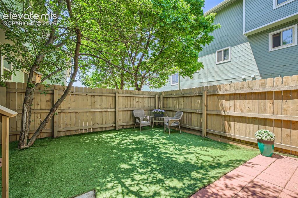 Image 20 of 31: Sweet, tidy yard with turf