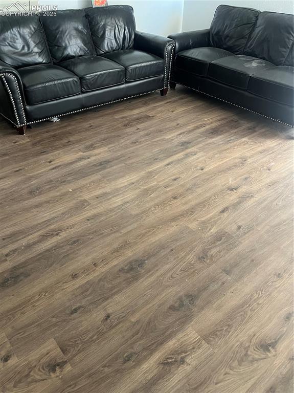 Image 4 of 11: Living room with wood finished floors