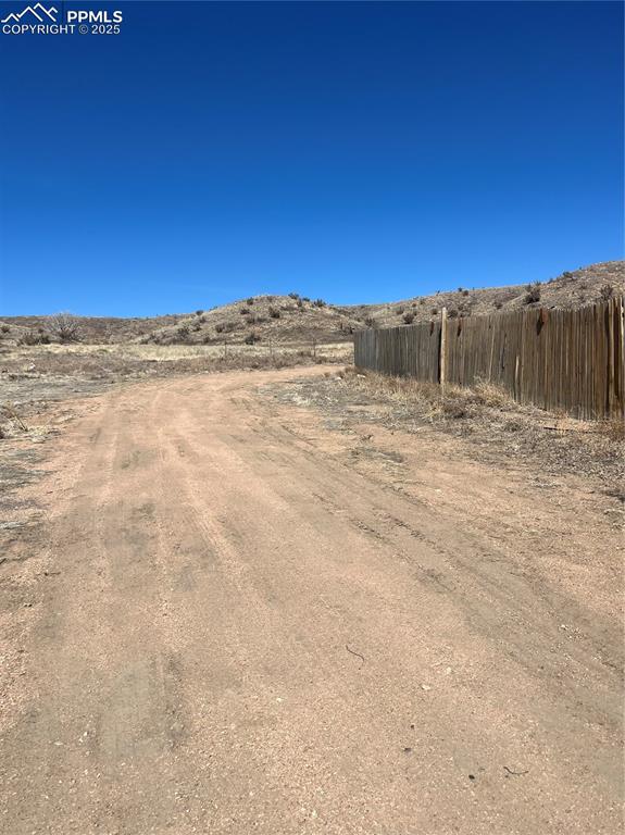 Image 9 of 11: View of yard with fence