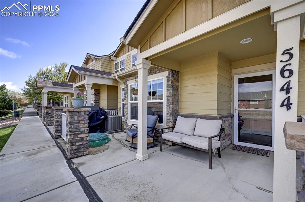 Image 4 of 34: Large entry patio area! Perfect for covered sitting!
