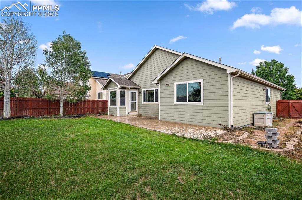 Image 6 of 35: Rear view of property with a patio area