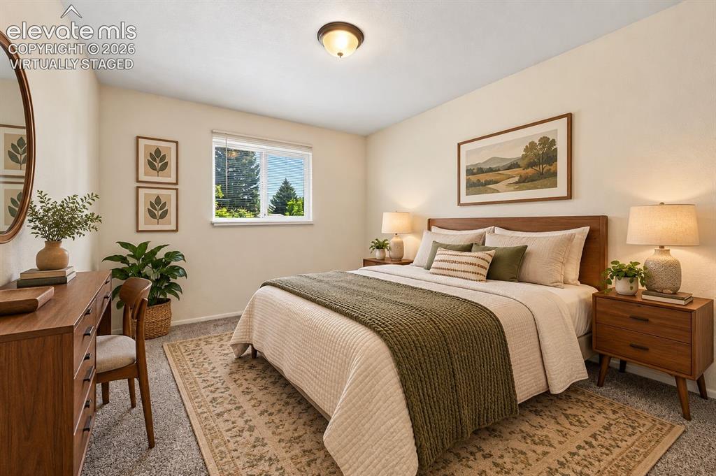 Image 10 of 28: virtually staged 2nd bedroom with new carpet.