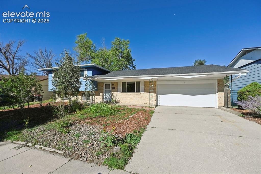 Image 18 of 28: siding facade, an attached garage, and a concrete driveway