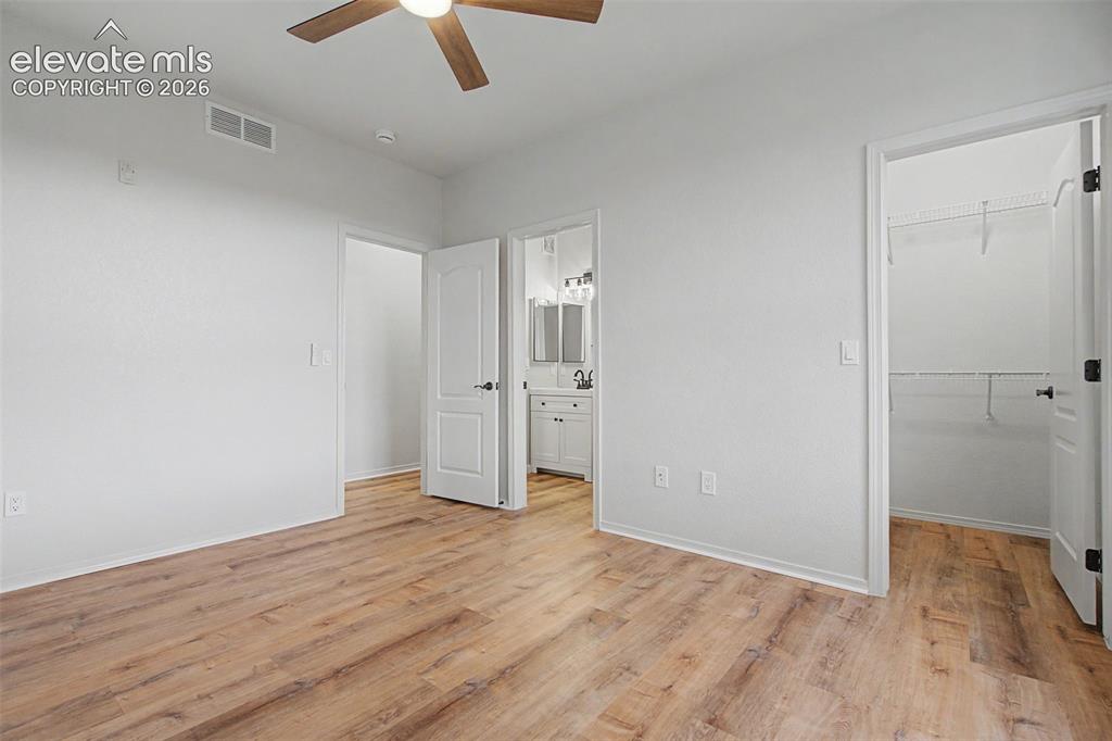 Image 18 of 23: New LVP flooring and ceiling fan with integrated lighting and fresh paint