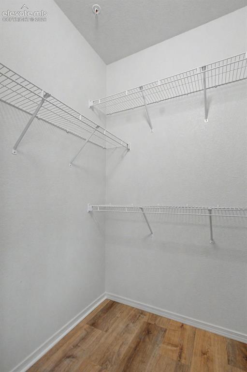 Image 22 of 23: Primary walk-in closet