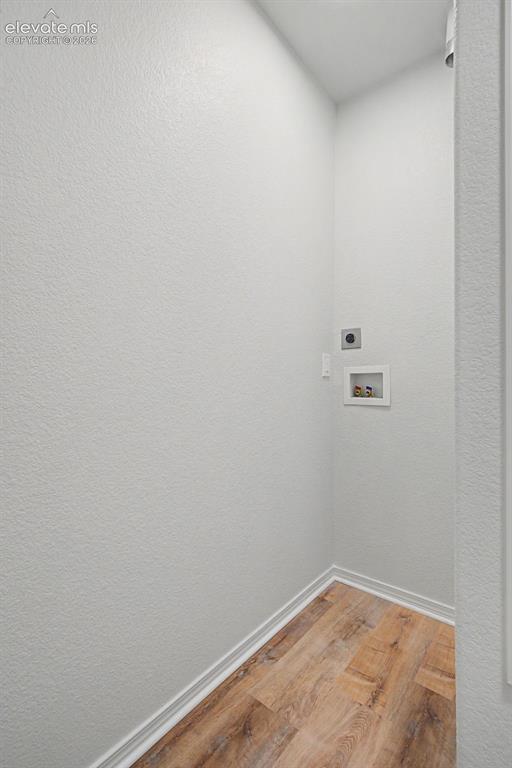 Image 6 of 23: Dedicated laundry room featuring new LVP flooring