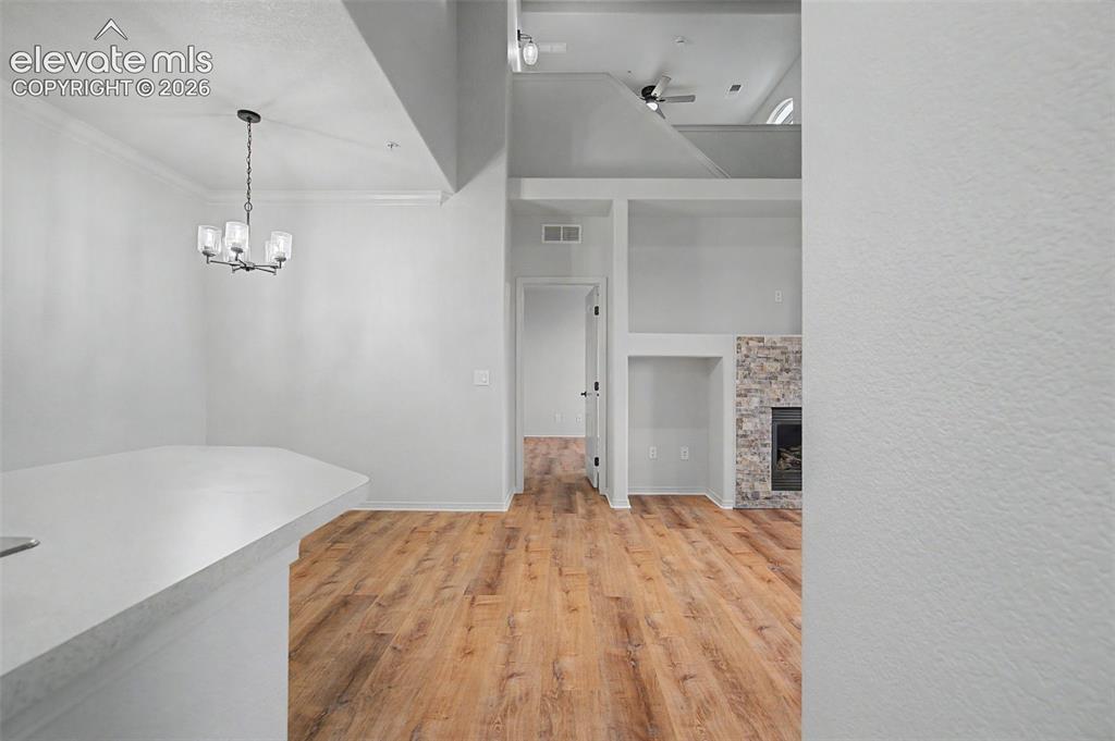 Image 9 of 23: Open concept dining area with new light fixture