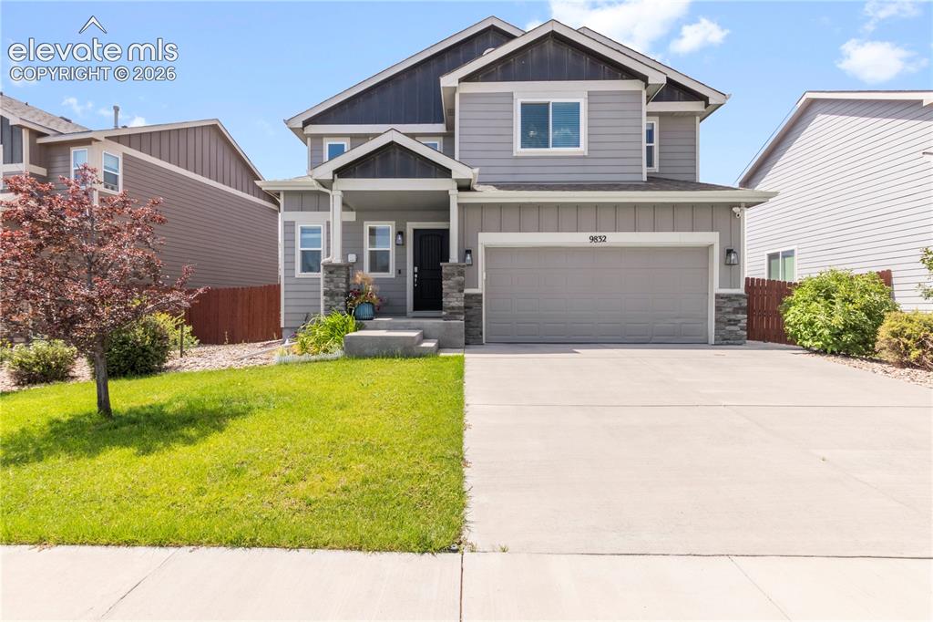 Image 1 of 38: Two-story exterior with gray siding and dark trim accents