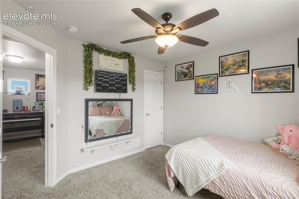 Image 30 of 38: Gray wall paint and carpeted flooring