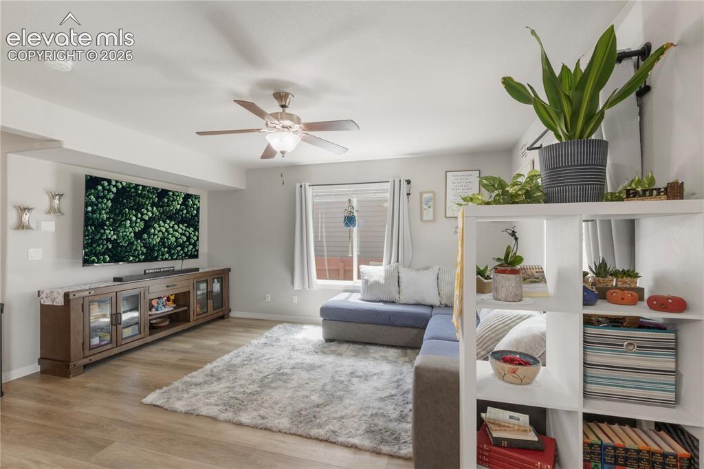 Image 6 of 38: Wood-finish flooring, ceiling fan with integrated lighting, recessed lighti