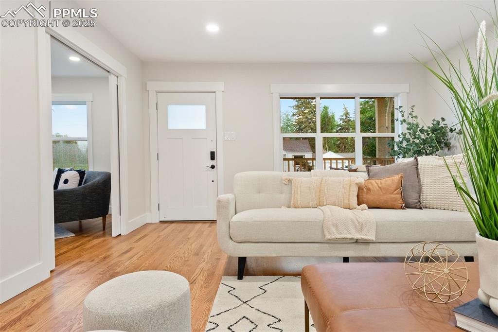 Image 6 of 39: New windows, doors and trim. Solid Oak hardwood floors.