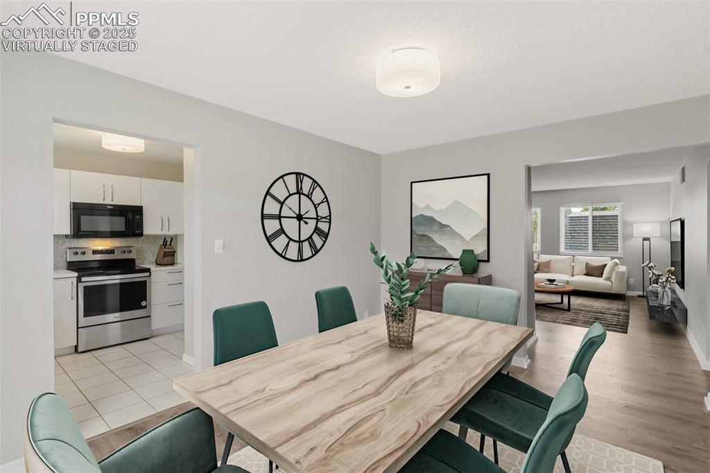 Image 13 of 48: Virtually Staged - Dining space with baseboards and light wood-type floorin