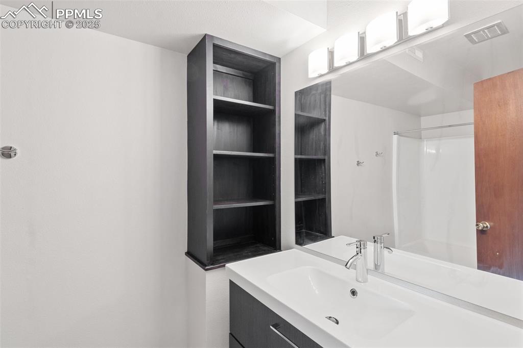 Image 27 of 48: 2nd Bathroom featuring vanity