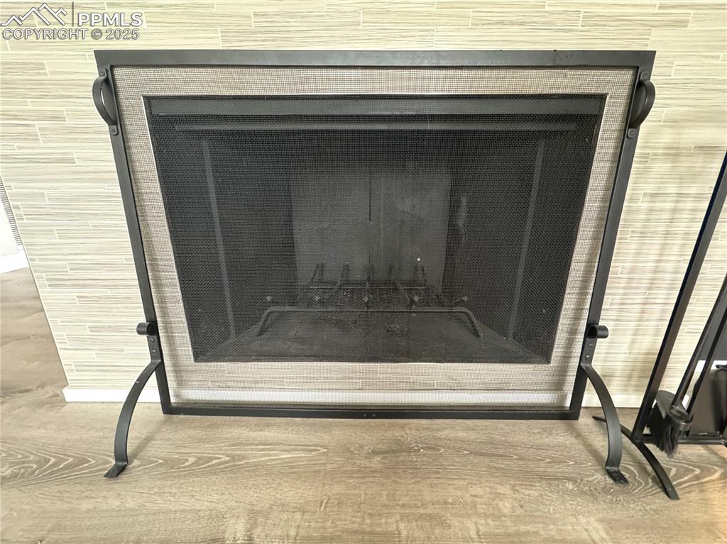 Image 42 of 48: Detailed view of a tile fireplace