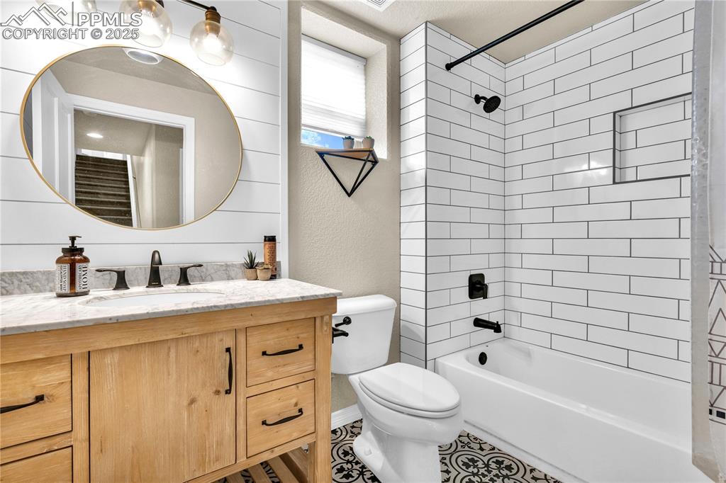 Image 16 of 29: Full bathroom featuring vanity, shower / washtub combination, and a texture