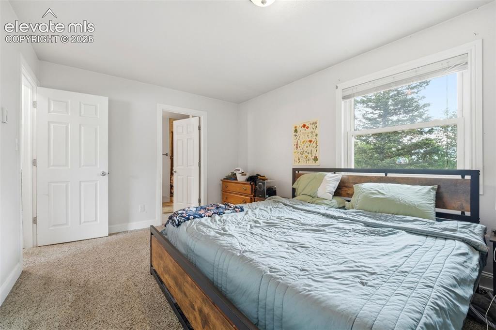 Image 14 of 46: Upstairs unit primary bedroom