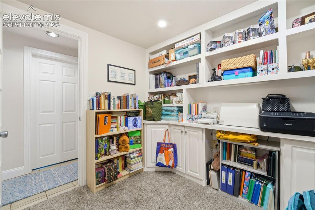 Image 34 of 46: Downstairs unit office, built in shelving