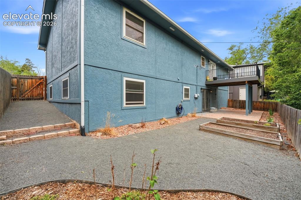 Image 36 of 46: Back porch accessible by downstairs unit