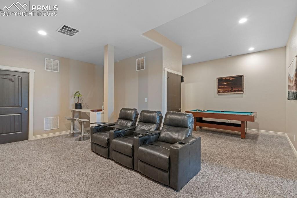 Image 26 of 50: Cinema room featuring billiards, light colored carpet, and recessed lightin