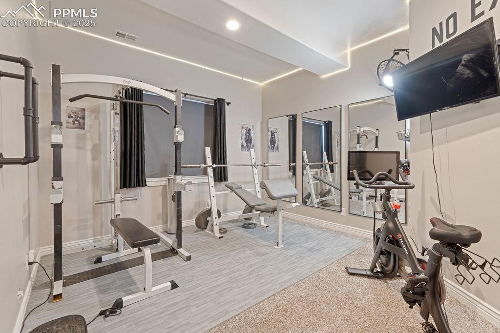 Image 31 of 50: Exercise area featuring recessed lighting