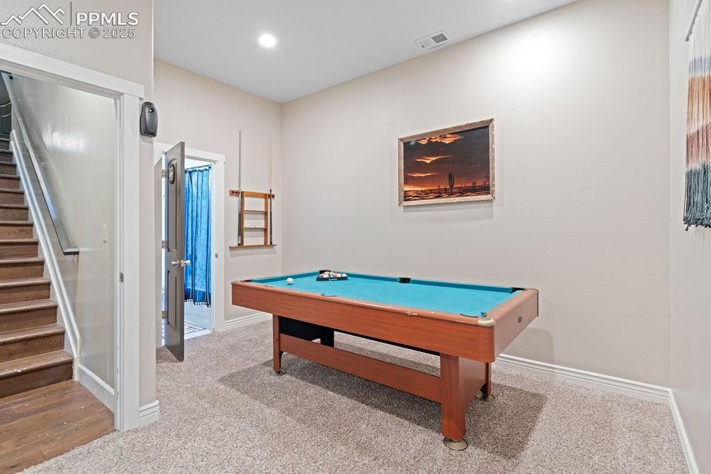 Image 37 of 50: Recreation room featuring light carpet, pool table, and recessed lighting