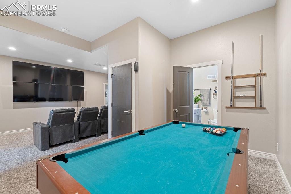 Image 39 of 50: Recreation room with carpet floors, billiards table, and recessed lighting