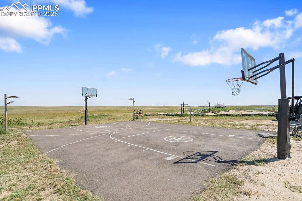 Image 46 of 50: View of sport court featuring community basketball court