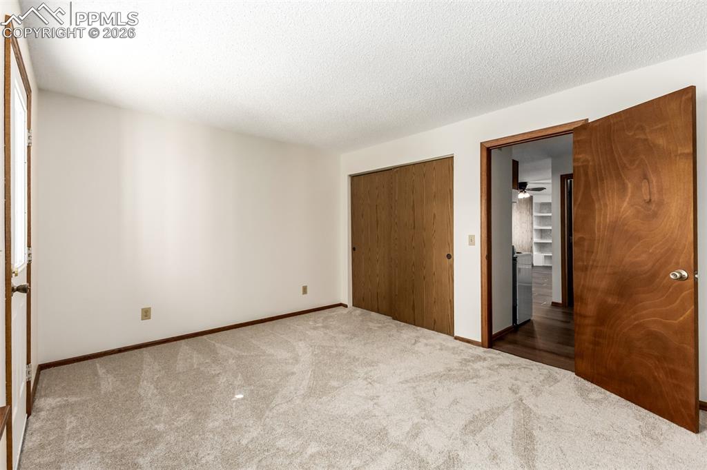 Image 12 of 25: Efficient kitchen layout with ample cabinetry and counter space.