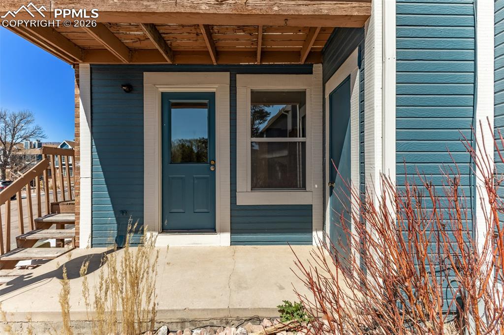 Image 16 of 25: Spacious bedroom with new carpet, natural light, and private exterior acces