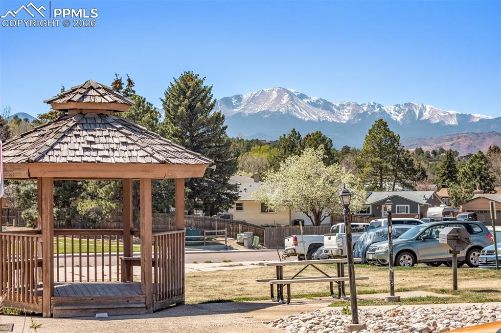 Image 19 of 25: In-unit laundry with stacked washer and dryer for added convenience.